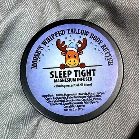 Moose's Sleep Tight Magnesium Whipped Tallow Body Butter tin on a cozy blanket