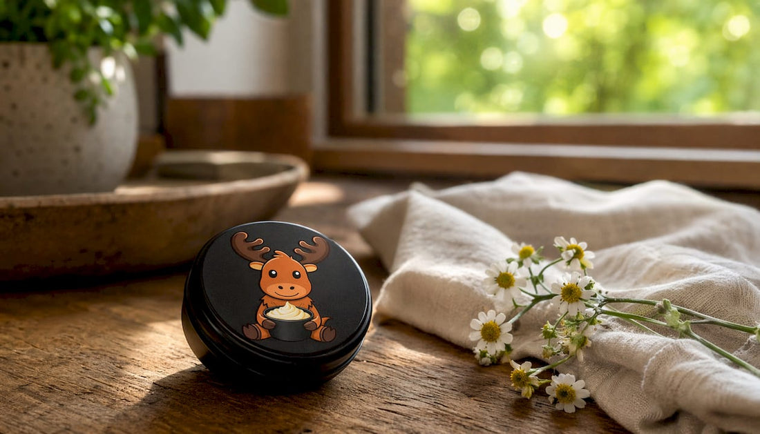 Black matte tin tallow container on wooden surface