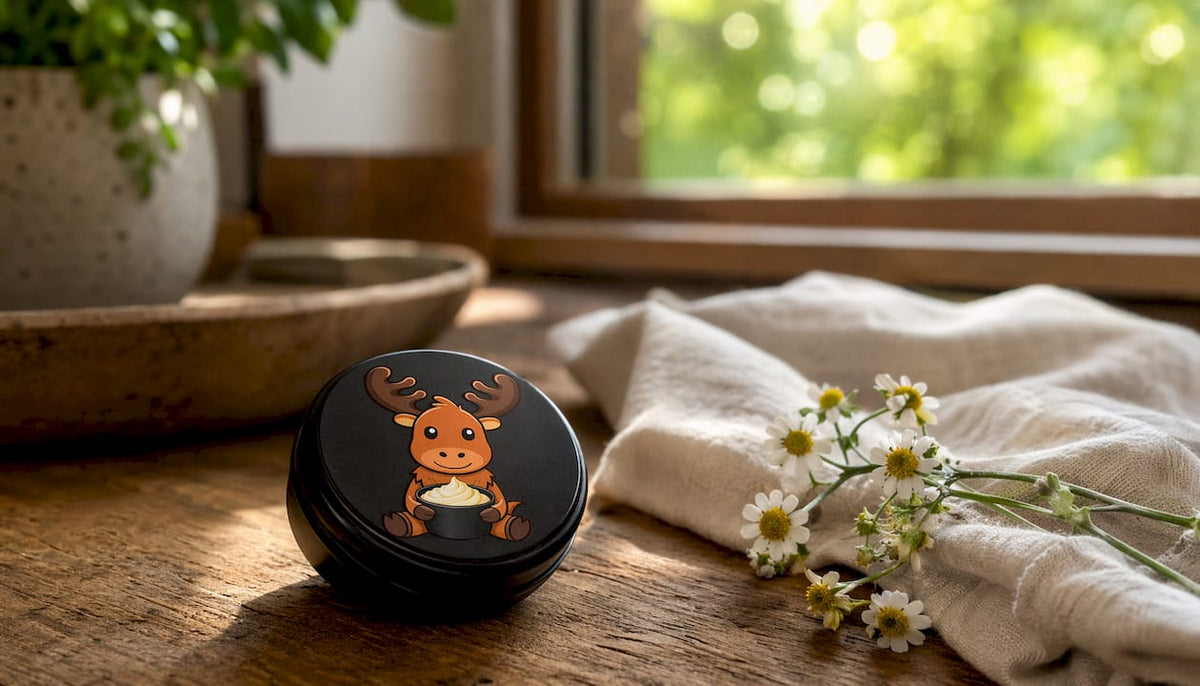 Black matte tin tallow container on wooden surface