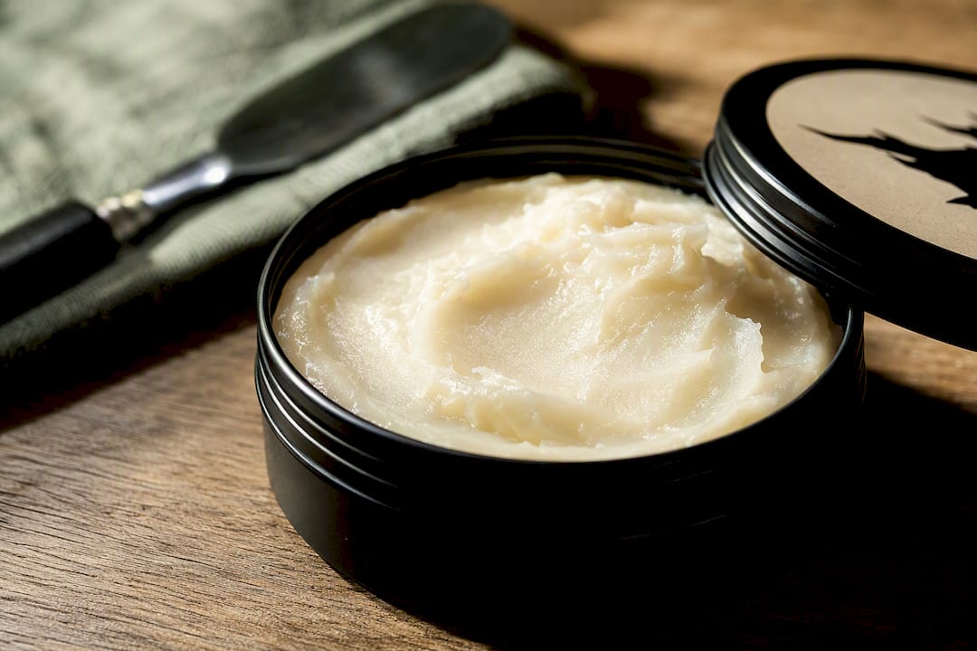 Creamy rendered tallow in black matte tin