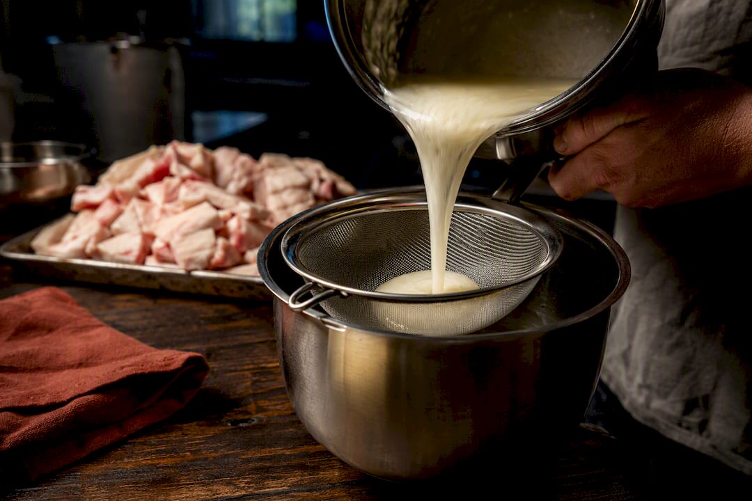Small-batch beef tallow being carefully rendered