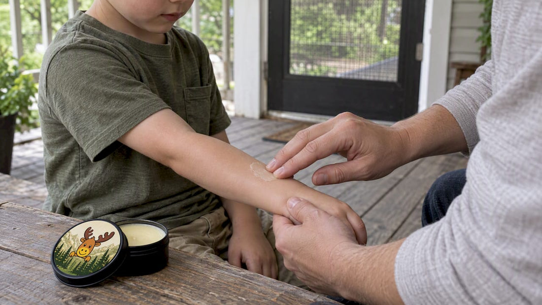 Parent applying bug balm to child’s arm