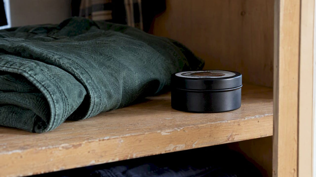Black matte tin of tallow deodorant on shelf