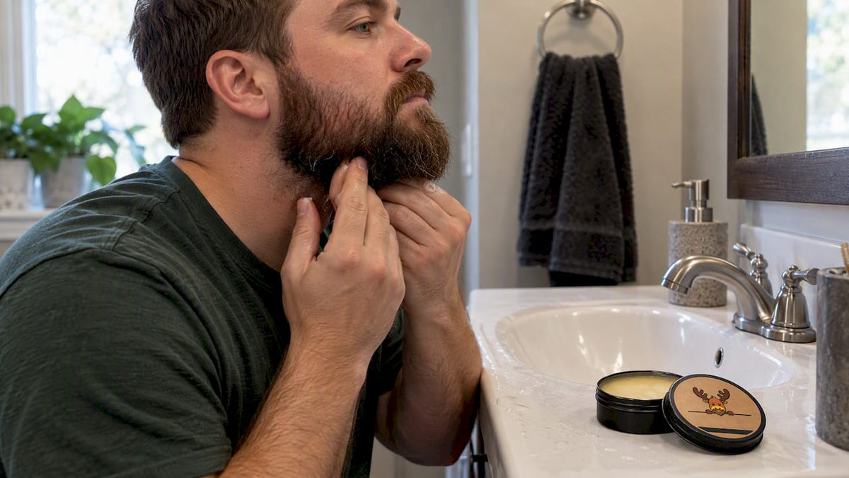 Man applying balm beneath his beard
