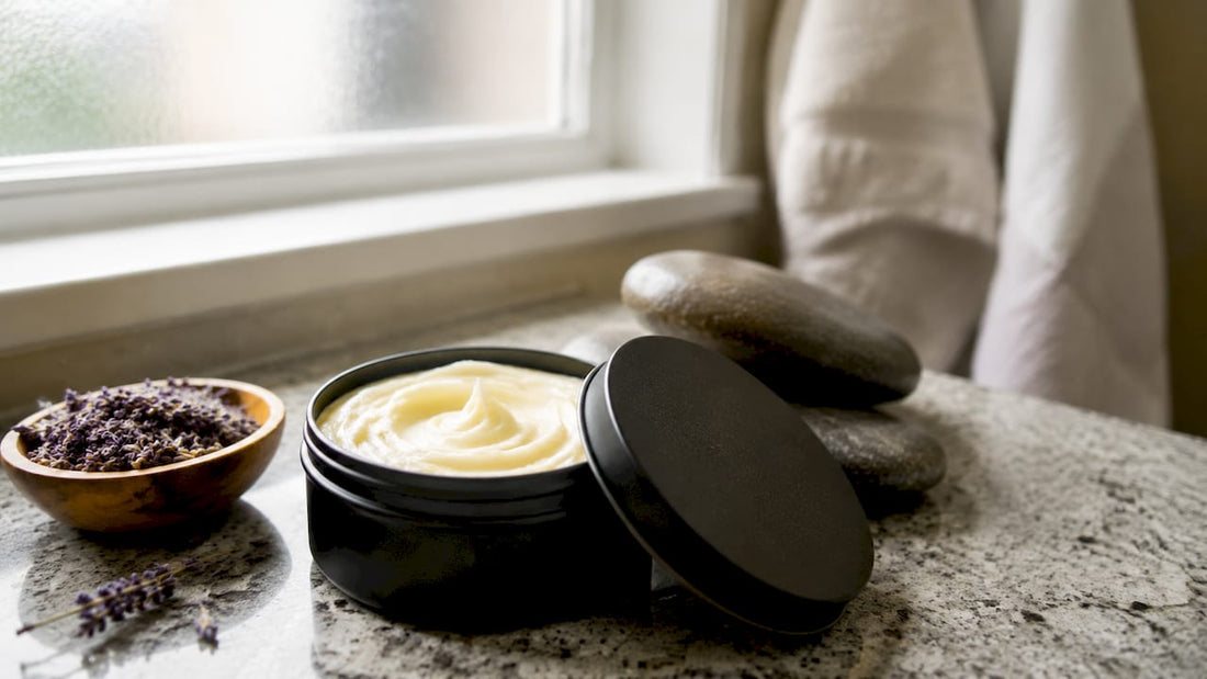 Open black matte tin tallow container on wooden tabletop