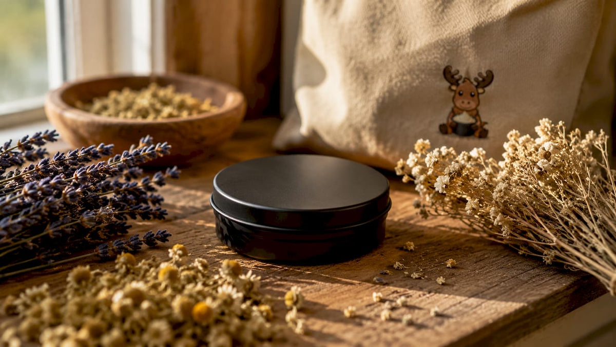 Black matte tin tallow container on linen fabric
