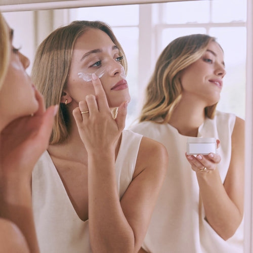 Two young women applying natural tallow eye cream while getting ready — Moose's Tallow bridal skincare gift sets