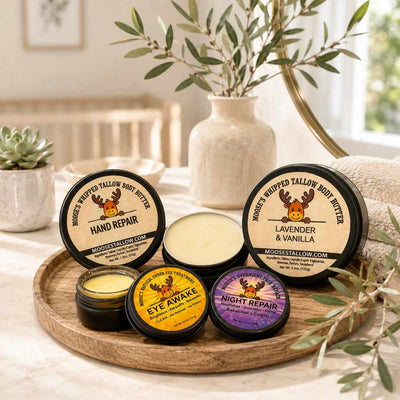 Moose's Tallow mature skincare tray with Hand Repair, Lavender & Vanilla body butter, Eye Awake, and Night Repair among olive branches