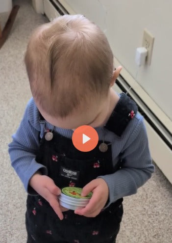 5-star video review for Natural Tallow Baby Butter: My toddler asks for it, toddler holding the tin - Kelly