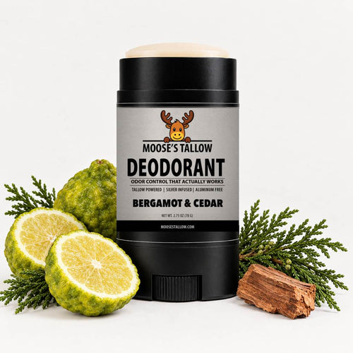 Bergamot & Cedar tallow baking soda free deodorant stick, aluminum-free, beside fresh bergamot and cedar