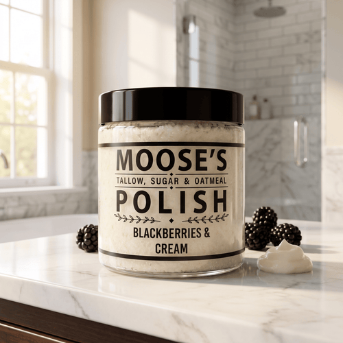 Blackberries & Cream Sugar Scrub jar on a bright bathroom counter with fresh blackberries