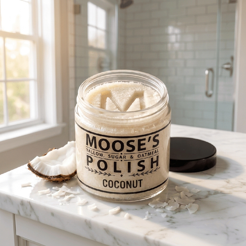 Coconut Sugar Polish, open jar with the Moose's M pressed into the white scrub
