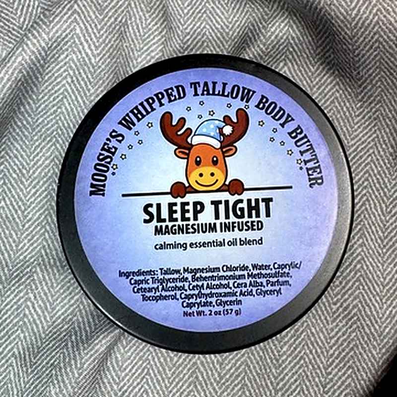 Moose's Sleep Tight Magnesium Whipped Tallow Body Butter tin on a cozy blanket
