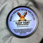 Moose's Sleep Tight Magnesium Whipped Tallow Body Butter tin on a cozy blanket