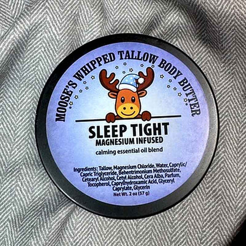 Moose's Sleep Tight Magnesium Whipped Tallow Body Butter tin on a cozy blanket