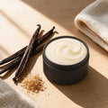 Warm Sugar Whipped Tallow Body Butter open black tin with vanilla bean pods and brown sugar chunks