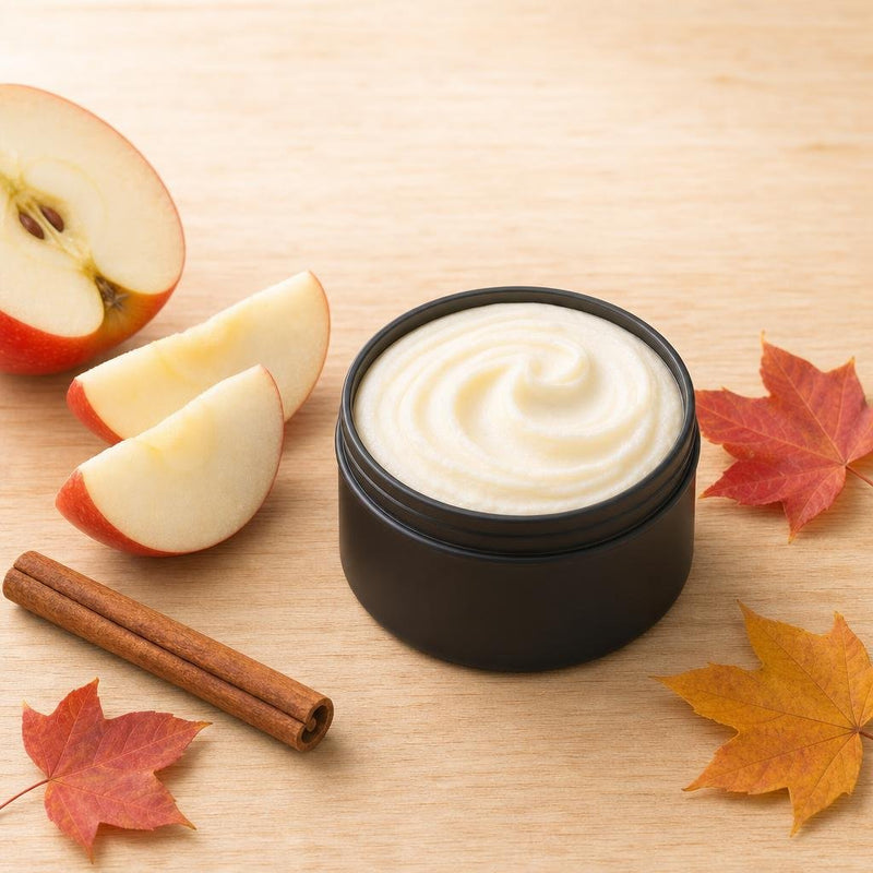 Apple snap whipped tallow body butter in a matte black tin with apple and cinnamon